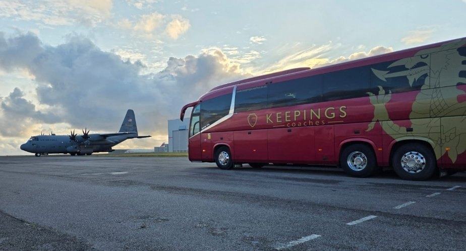Keepings Coaches red executive coach at airport